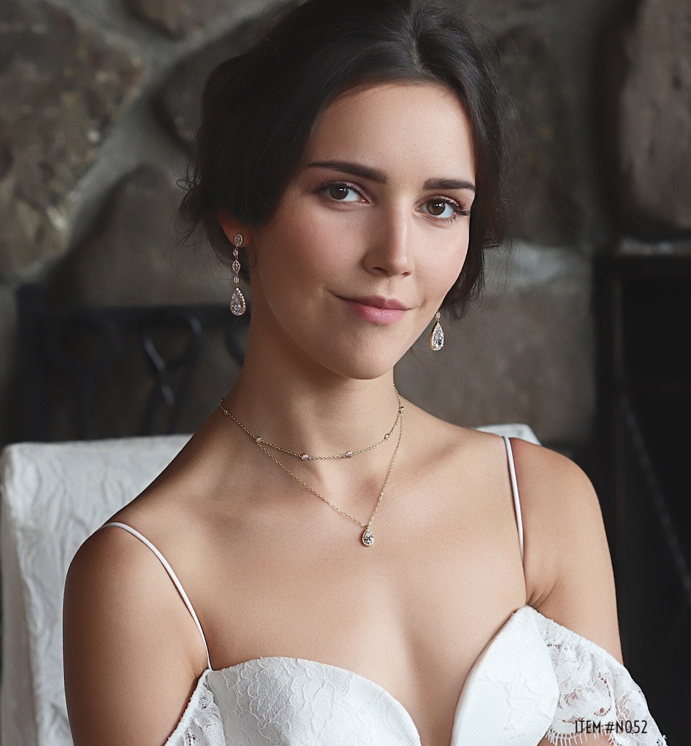 caption: Model wearing crystal chain teardrop layered necklace